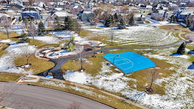 snowy aerial view featuring a residential view
