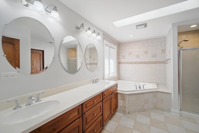 full bath featuring a sink, a bath, and a shower stall