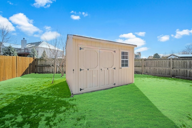 view of shed featuring a fenced backyard