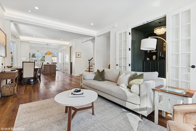 living area featuring stairway, french doors, recessed lighting, and wood finished floors