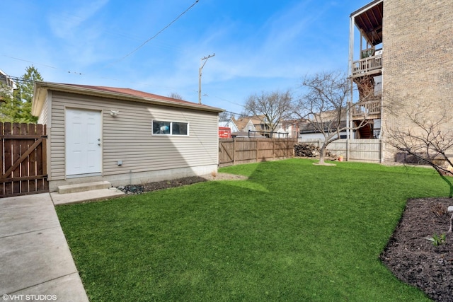 view of yard featuring a fenced backyard and a gate