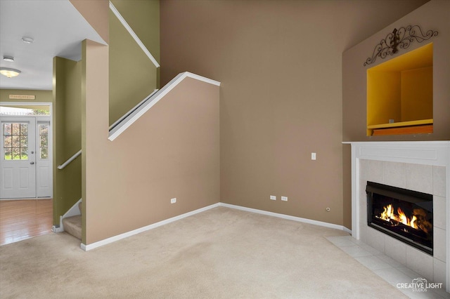 2823 White Thorn Cir, Naperville, IL 60564 - unfurnished living room featuring carpet floors, stairway, baseboards, and a fireplace