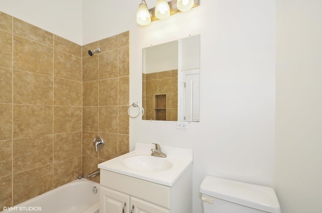 bathroom with shower / bathing tub combination, vanity, and toilet