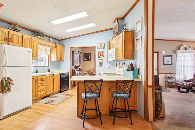 kitchen with white appliances, a textured ceiling, and ornamental molding