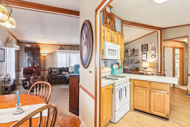 kitchen featuring ornamental molding, a peninsula, white appliances, light wood-style floors, and open floor plan