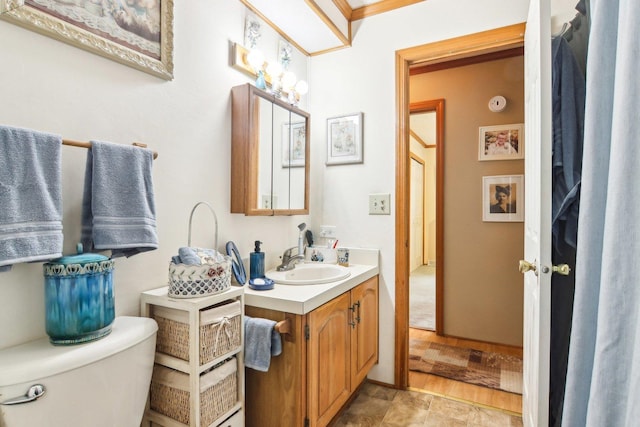 bathroom featuring vanity and toilet