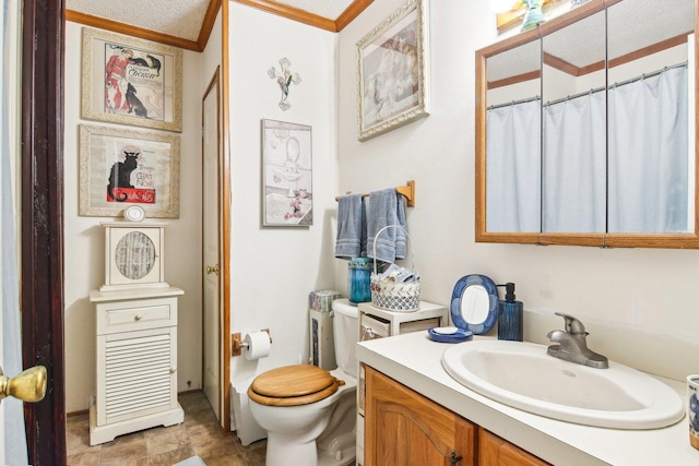 full bathroom with vanity, ornamental molding, and toilet
