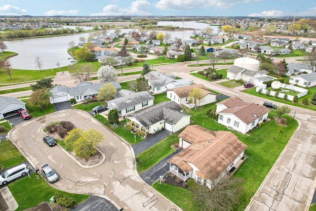 aerial view featuring a water view and a residential view