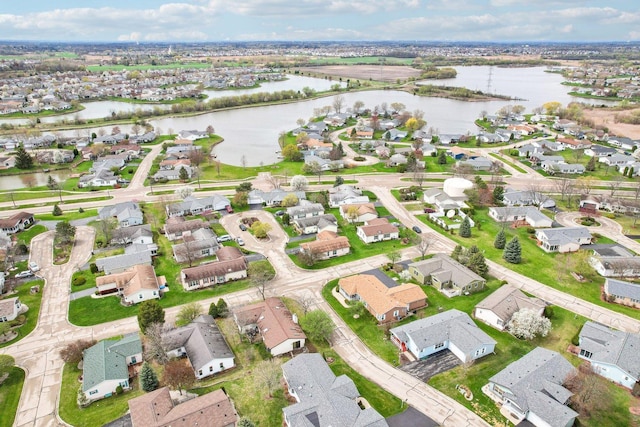 bird's eye view featuring a residential view and a water view