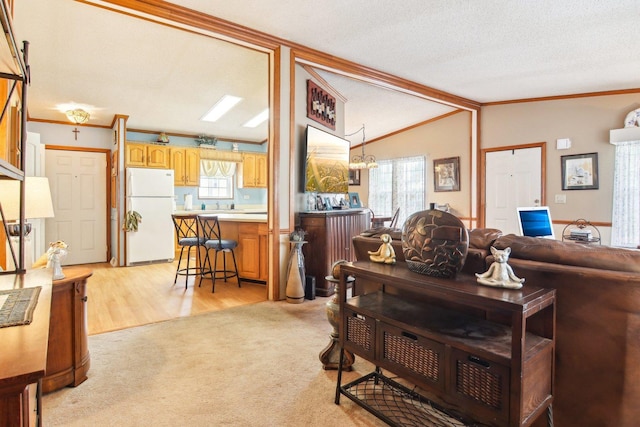living room with light colored carpet, ornamental molding, and vaulted ceiling