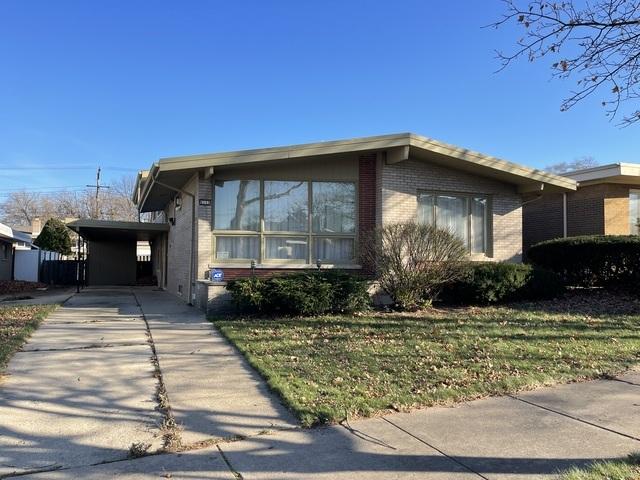 view of home's exterior with an attached carport, brick siding, and concrete driveway