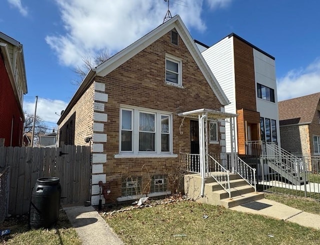 936 N Karlov Ave, Chicago, IL 60651 - view of front of property featuring fence and brick siding