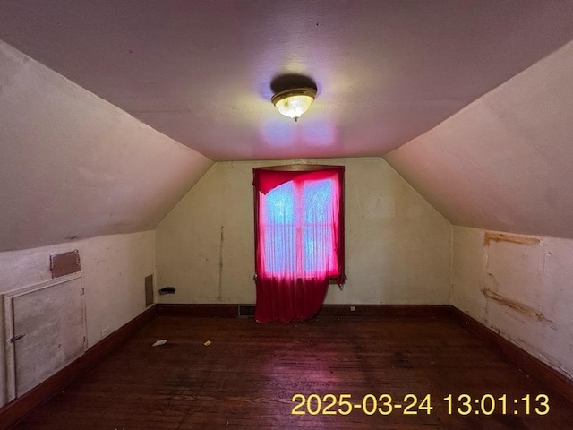 936 N Karlov Ave, Chicago, IL 60651 - additional living space featuring baseboards, visible vents, wood finished floors, and vaulted ceiling
