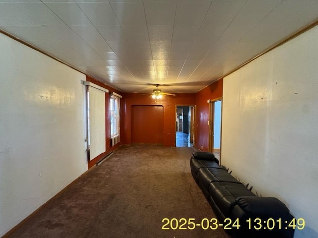 936 N Karlov Ave, Chicago, IL 60651 - unfurnished living room featuring carpet flooring, crown molding, a baseboard heating unit, and a ceiling fan
