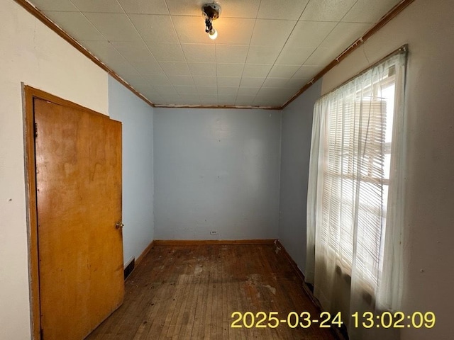 936 N Karlov Ave, Chicago, IL 60651 - unfurnished room with baseboards, crown molding, and hardwood / wood-style floors