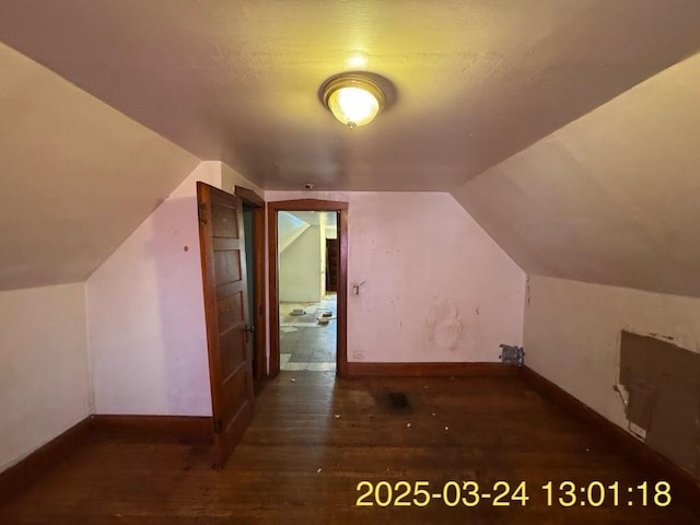 936 N Karlov Ave, Chicago, IL 60651 - bonus room with baseboards, wood finished floors, and vaulted ceiling