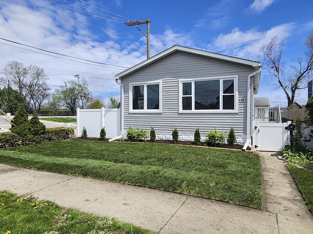 4147 Prairie St, Schiller Park, IL 60176 - view of side of home featuring a lawn and fence