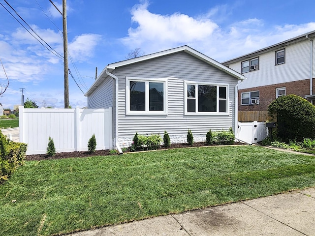4147 Prairie St, Schiller Park, IL 60176 - view of front of property with fence and a front lawn