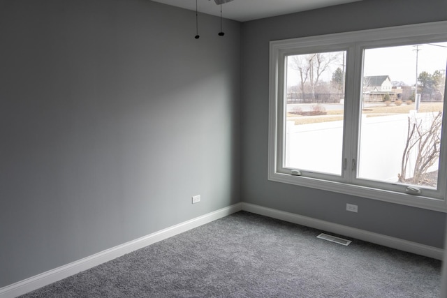 4147 Prairie St, Schiller Park, IL 60176 - unfurnished room featuring visible vents, carpet flooring, baseboards, and a healthy amount of sunlight