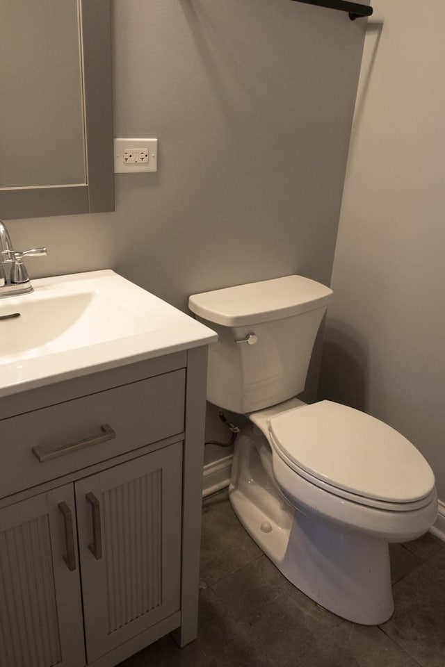 4147 Prairie St, Schiller Park, IL 60176 - bathroom with toilet, baseboards, tile patterned floors, and vanity