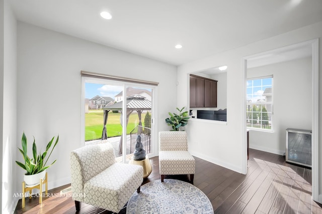 sitting room featuring recessed lighting, baseboards, and wood finished floors
