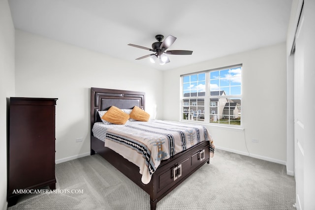 bedroom featuring baseboards, a ceiling fan, and carpet flooring