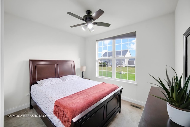 bedroom featuring light carpet, baseboards, and visible vents