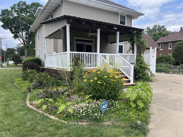 211 W 13th St, Sterling, IL 61081 - view of front of house featuring ceiling fan, a front yard, and covered porch