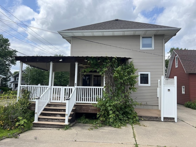 211 W 13th St, Sterling, IL 61081 - rear view of property featuring a porch and a shingled roof