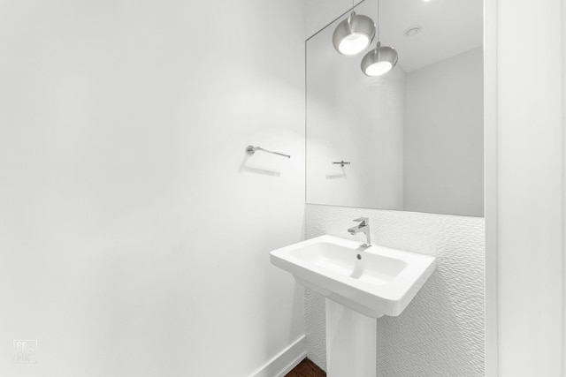 bathroom featuring a sink and wood finished floors