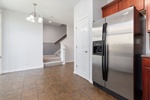 3576 Gabrielle Ln, Aurora, IL 60504 - kitchen featuring stainless steel fridge with ice dispenser, a chandelier, baseboards, hanging light fixtures, and stone finish flooring