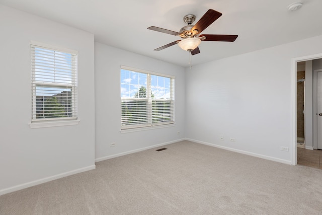 3576 Gabrielle Ln, Aurora, IL 60504 - empty room with light carpet, a smoke detector, baseboards, and a ceiling fan