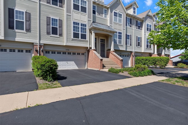 3576 Gabrielle Ln, Aurora, IL 60504 - townhome / multi-family property with an attached garage, driveway, a residential view, and brick siding