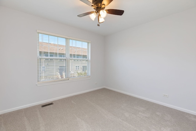 3576 Gabrielle Ln, Aurora, IL 60504 - empty room featuring carpet flooring, baseboards, and ceiling fan
