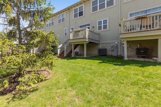3576 Gabrielle Ln, Aurora, IL 60504 - back of property featuring central air condition unit, stairs, and a lawn