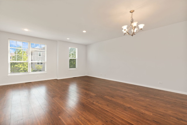 3576 Gabrielle Ln, Aurora, IL 60504 - spare room featuring a chandelier, dark wood-style flooring, baseboards, and recessed lighting