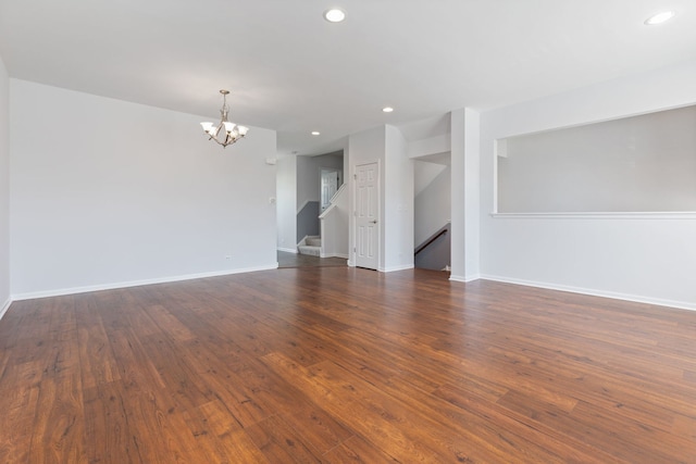 3576 Gabrielle Ln, Aurora, IL 60504 - unfurnished living room featuring a chandelier, recessed lighting, dark wood finished floors, and baseboards