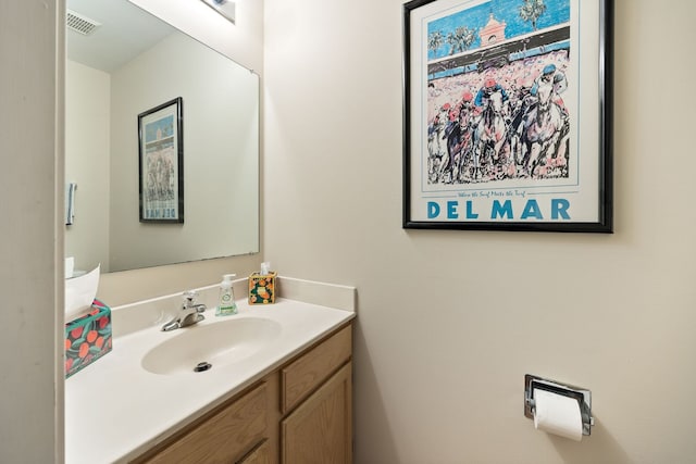 bathroom featuring vanity and visible vents