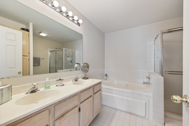 bathroom with a shower stall, tile patterned floors, a bath, and a sink