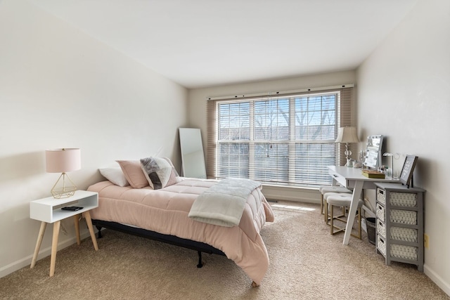 carpeted bedroom with baseboards