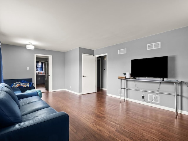 339 Clyde Ave, Calumet City, IL 60409 - living room featuring wood finished floors, baseboards, and visible vents