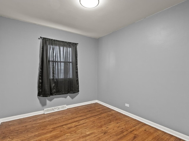 339 Clyde Ave, Calumet City, IL 60409 - empty room featuring baseboards, visible vents, and wood finished floors