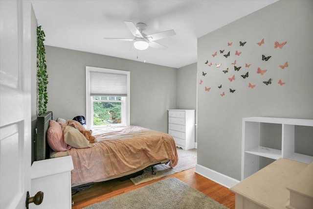 708 W Church St, Champaign, IL 61820 - bedroom featuring wood finished floors and ceiling fan