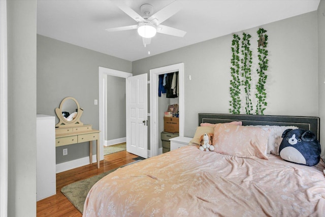 708 W Church St, Champaign, IL 61820 - bedroom featuring wood finished floors and a ceiling fan