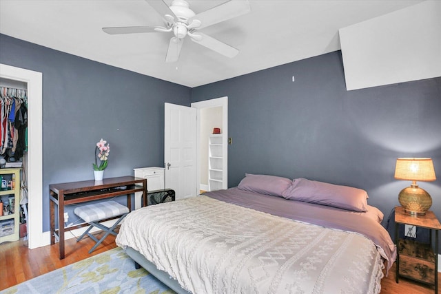 708 W Church St, Champaign, IL 61820 - bedroom featuring wood finished floors, a closet, and ceiling fan