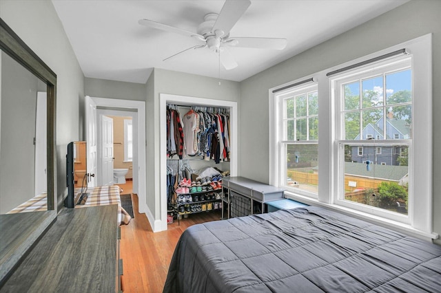 708 W Church St, Champaign, IL 61820 - bedroom with light wood-type flooring, a closet, and ceiling fan
