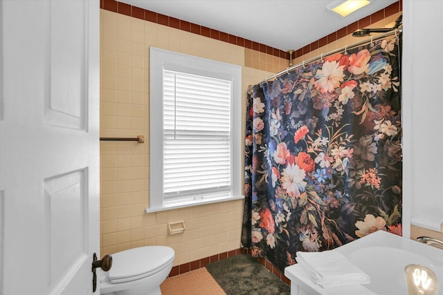 708 W Church St, Champaign, IL 61820 - full bathroom with tile walls, tile patterned floors, and a shower with curtain