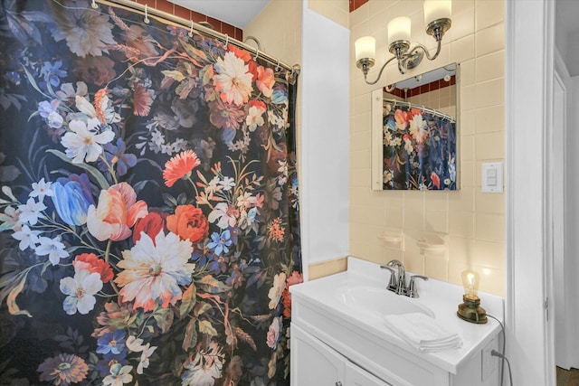 708 W Church St, Champaign, IL 61820 - bathroom with vanity, tile walls, and curtained shower