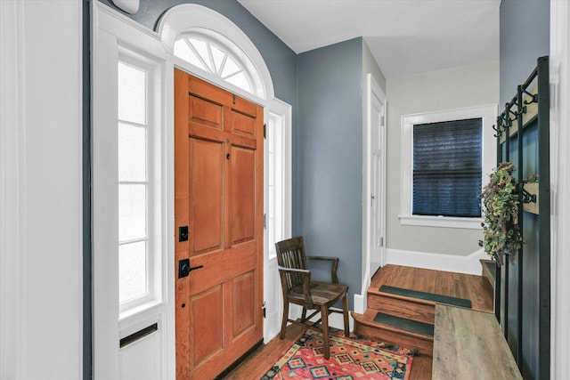 708 W Church St, Champaign, IL 61820 - entryway featuring wood finished floors and stairs