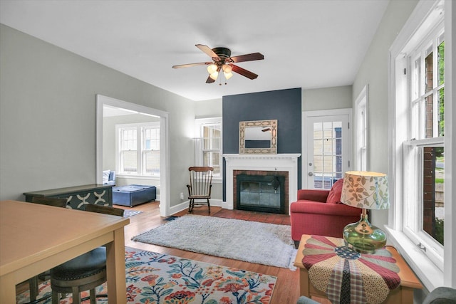 708 W Church St, Champaign, IL 61820 - living room with a ceiling fan, a fireplace, and wood finished floors